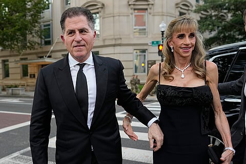 Michael Dell, founder, chairman and CEO of Dell Technologies, and his wife Susan Dell, co-founder and board chair of the Michael & Susan Dell Foundation, walk to the White House to attend a state dinner hosted for China's President Xi Jinping, Thursday, Sept. 24, 2026, in Washington.