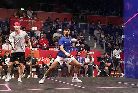 India’s Abhay Singh, right, and Japan’s Ryunosuke Tsukue compete during a men’s singles quarterfinal Squash match in the ongoing Asian Games, in Nagoya, Japan.