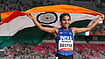 Asian Games 2026: Protecting Her 78-Year-Old Mother's Heart Inspired Seema Kumari's 10,000m Bronze | Photo: PTIArun Sharma : India’s Seema holds the national flag as she celebrates after winning the bronze medal in the women's 10,000m final during the Asian Games 2026, in Nagoya, Japan, Thursday, Sept. 24, 2026.
