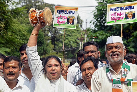 Uttarakhand police personnel stop Congress workers from marching towards Uttarakhand Secretariat during a protest against Chief Election Commissioner (CEC) Gyanesh Kumar, demanding his resignation and immediate arrest, in Dehradun, Friday, Sept. 25, 2026. 