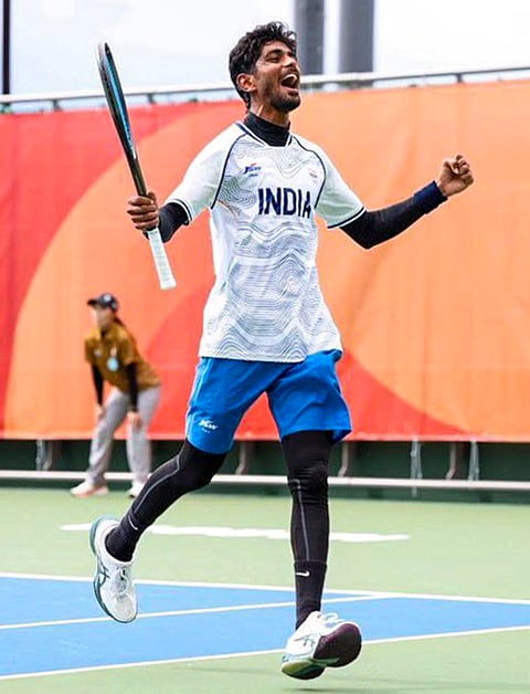 India's Jay Meena celebrates during a soft tennis match at the 20th Asian Games, in Nagoya, Japan. Meena secured India's first ever soft tennis medal at the Asian Games, fetching a bronze after losing to Japan's Takuya Kurosaka in the men's singles semifinals on Wednesday. 
