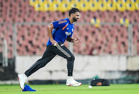 Auqib Nabi in the middle of his run-up during the Indian team's net session ahead of the ODI series against the West Indies.