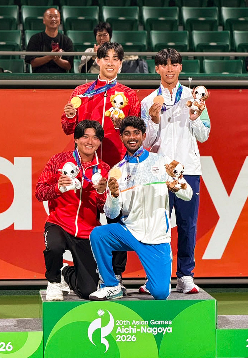 Jay Meena poses with medalists during soft tennis presentation ceremony at 20th Asian Games