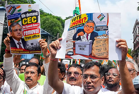 West Bengal Pradesh Congress Committee (WBPCC) President Subhankar Sarkar along with party workers hold placards and stage a protest against Chief Election Commissioner (CEC) Gyanesh Kumar, demanding his resignation and immediate arrest, in Kolkata, Friday, Sept. 25, 2026. 