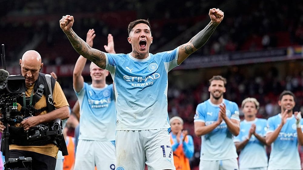 Manchester City's Enzo Fernandez celebrates in front of the away fans after the English Premier League soccer match against Manchester United in Manchester, England, Sunday Sept. 13, 2026.
 - | Photo: Peter Byrne/PA via AP