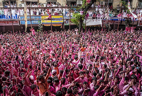 People take part as the 'Lalbaugcha Raja' idol of Lord Ganesha is taken out in a grand procession for immersion on the occasion of Anant Chaturdashi, in Mumbai, Friday, Sept. 25, 2026. 