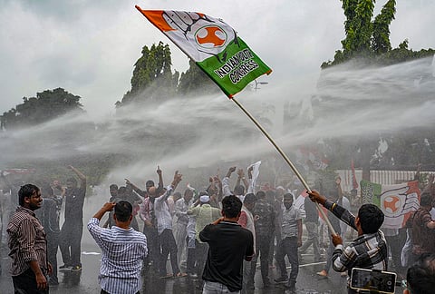 Police personnel deploy a water cannon against Congress supporters during a protest rally to Bihar State Election Commission against alleged unilateral decisions of Chief Election Commissioner (CEC) Gyanesh Kumar and over issues related to the SIR and voter lists, in Patna, Friday, Sept. 25, 2026. 