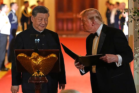 President Donald Trump talks with China's President Xi Jinping during a State Dinner in the East Room of the White House, Thursday, Sept. 24, 2026, in Washington.