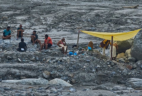 Nepalese people perform religious rituals on the bank of Trishuli river at Dunge, Nuwakot, Nepal, Wednesday, Sept. 23, 2026.