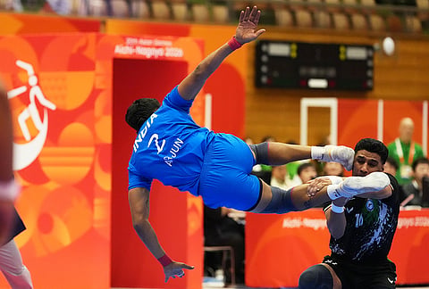India's Arjun Deshwal and Iran's Amirhossein Bastami compete during the men's kabaddi final at the Asian Games in Tokai City, Japan, Saturday, Sept. 26, 2026.