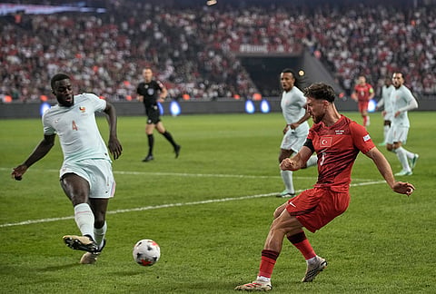 France's Dayot Upamecano blocks the cross from Turkey's Salih Ozcan during the UEFA Nations League soccer match between Turkey and France in Izmit, Turkey, Friday, Sept. 25, 2026. 