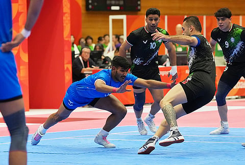 India's Devank leaps at Iran's Fazel Atrachali during the men's kabaddi final at the Asian Games in Tokai City, Japan, Saturday, Sept. 26, 2026. 