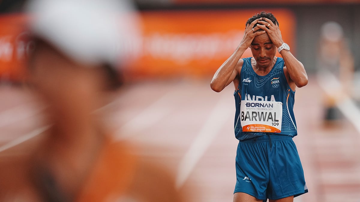 India's Sawan Barwal reacts after his second place finish in the men's marathon at the Asian Games in Nagoya, Japan, Saturday, Sept. 26, 2026. - (AP Photo/Lee Jin-man)