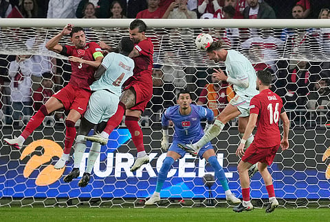 France's Adrien Rabiot goes for a header during the UEFA Nations League soccer match between Turkey and France in Izmit, Turkey, Friday, Sept. 25, 2026. 