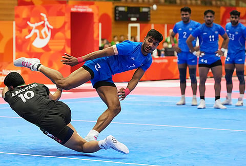 India's Devank and Iran's Amirhossein Bastami compete during the men's kabaddi final at the Asian Games in Tokai City, Japan, Saturday, Sept. 26, 2026. 
