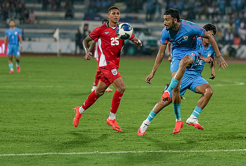 India forward Manvir Singh, 9, leaps to control the ball while Panama midfielder Edward Cedeño, 25, closes in during a FIFA international friendly match, in Bengaluru, Karnataka, Friday, Sept. 25, 2026.
