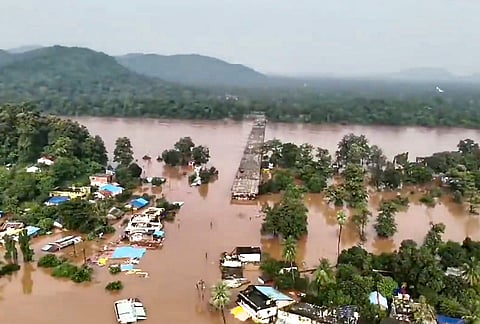 Floodwaters inundate an area following continuous downpour, at Bhamragad, in Gadchiroli, Maharashtra.