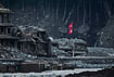 In Photos |Nepal Floods, One Month Later: A Nation Still Counting The Cost | Photo: AP/Niranjan Shrestha : A Nepalese flag flies amid houses damaged by flash floods along the banks of the Trishuli River in Dunge, in Nepal's Nuwakot district, Wednesday, Sept. 23, 2026.