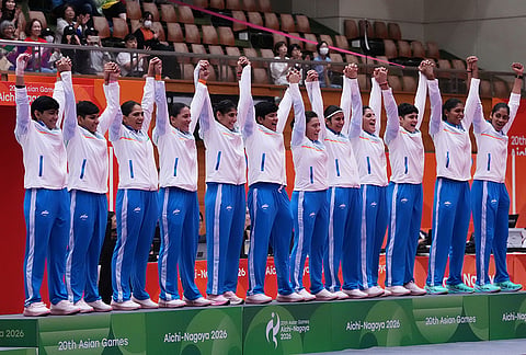 Indian team members pose on the podium before receiving their medals for the women's kabaddi at the Asian Games in Tokai City, Japan, Saturday, Sept. 26, 2026. 