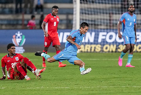 India defender Abhishek Singh Tekcham (No. 2) leaps over a sliding tackle from a Panama player while Panama defender Azarías Londoño (No. 9) watches on during a FIFA international friendly match, in Bengaluru, Karnataka, Friday, Sept. 25, 2026. 