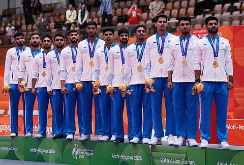 Gold medalist team India stand for their national anthem on the podium during the medal ceremony of the men's kabaddi at the Asian Games in Tokai City, Japan, Saturday, Sept. 26, 2026.