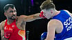 Asian Games 2026: Indian Boxer Pokhariya Advances to Quarterfinals Despite Tough Test from Iran's Estaki | Photo: PTI/Ravi Choudhary : India's Kapil Pokhariya, in red, competes against Scotland's Robert McNulty during the men's 90kg boxing match at the 23rd Commonwealth Games, in Glasgow, Scotland.
