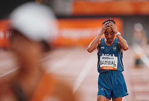 India's Sawan Barwal reacts after his second place finish in the men's marathon at the Asian Games in Nagoya, Japan.
