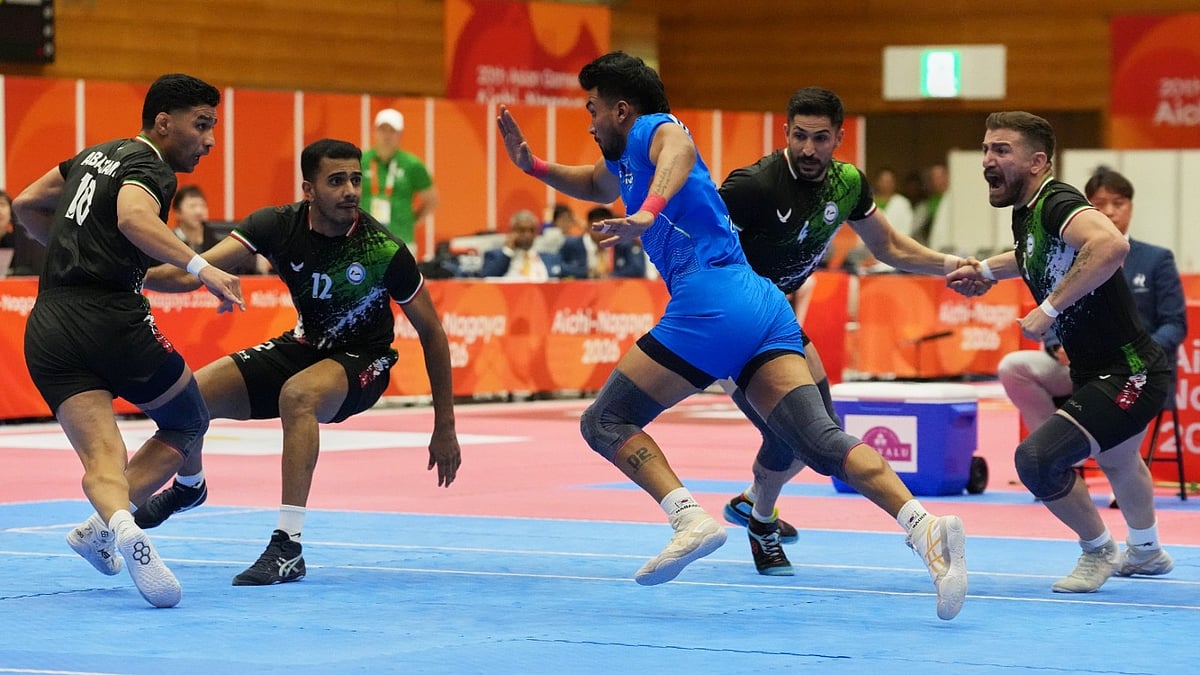 India's Arjun Deshwal, center, attempts a tag in the men's kabaddi final at the Asian Games in Tokai City, Japan, Saturday, Sept. 26, 2026. - | Photo: AP Photo/Mark Baker