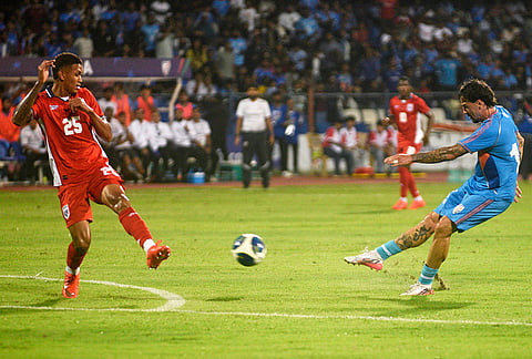 India's Ryan Williams, right, shoots at goal as Panama's Roderick Miller defends during an international friendly soccer match between India and Panama in Bengaluru, India, Friday, Sept. 25, 2026. 