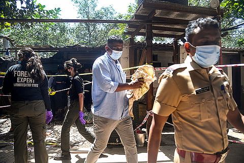 Fire personnel and other officials conduct an investigation following the death of two men due to suffocation after allegedly inhaling a toxic chemical inside a public toilet near the Parsi Panchayat Gate close to Mrunaltai Bridge at the Ram Mandir East area, in Mumbai, Maharashtra.