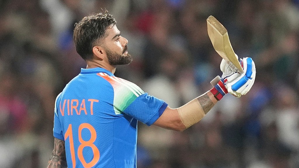 India's Virat Kohli celebrates his century during the first one day international cricket match between India and West Indies in Thiruvananthapuram, India.  - Rafiq Maqbool/AP Photo