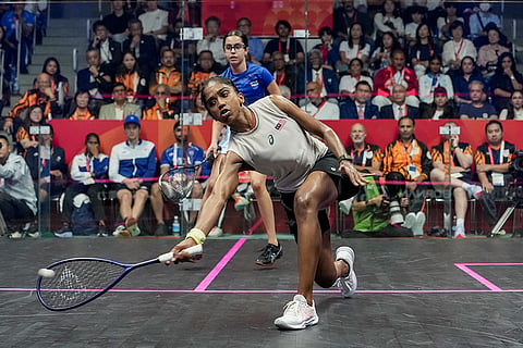 Malaysia’s Sivasangari Subramaniam, front, competes in the women’s singles final Squash match against India’s Anahat Singh in the ongoing 20th Asian Games, in Nagoya, Japan. Anahat Singh ends with a silver medal.