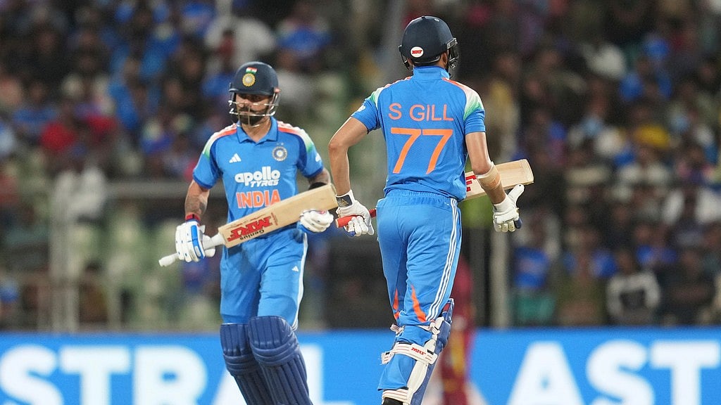 India's captain Shubman Gill, right, and Virat Kohli run between the wickets during the first one day international cricket match between India and West Indies in Thiruvananthapuram. - Rafiq Maqbool/AP Photo