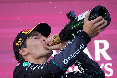 Mercedes driver George Russell of Britain celebrates after winning the Azerbaijan F1 Grand Prix auto race, in Baku, Azerbaijan, Saturday, Sept. 26, 2026.