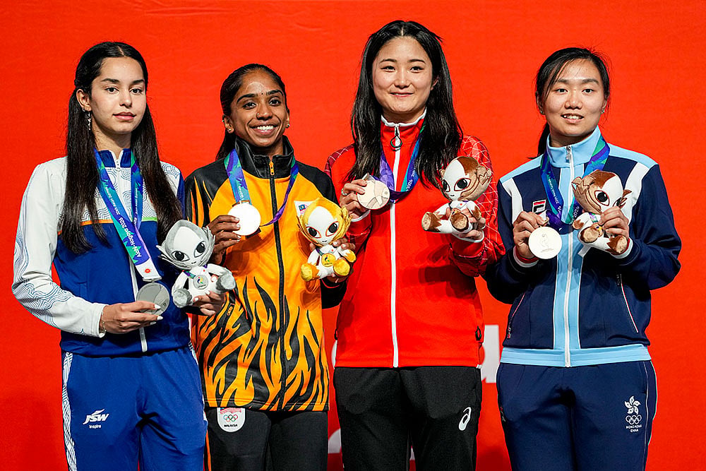 From left, India’s Anahat Singh, Malaysia's Sivasangari Subramaniam, Japan's Satomi Watanabe and Hong Kong's Simmi Chan wins Silver, Gold, and Bronze medals respectively in the women’s singles Squash event in the ongoing 20th Asian Games, in Nagoya, Japan. - | Photo: PTI/Arun Sharma