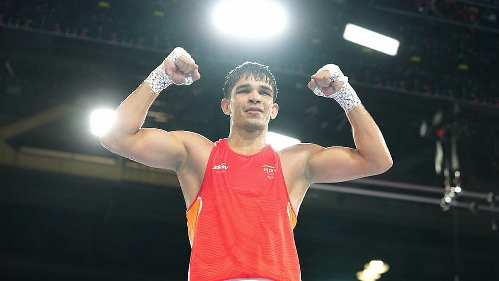 India's Ankush Panghal celebrates after winning the men's 80kg boxing final at the Commonwealth Games in Glasgow, Scotland. - Photo: AP/Eranga Jayawardena