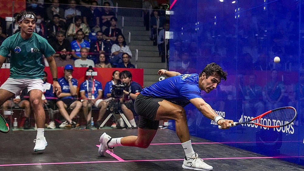 India’s Abhay Singh, right, competes in the men’s singles semifinal Squash match against Pakistan’s Muhammad Irfan in the ongoing 20th Asian Games, in Nagoya, Japan. - | Photo: PTI/Arun Sharma