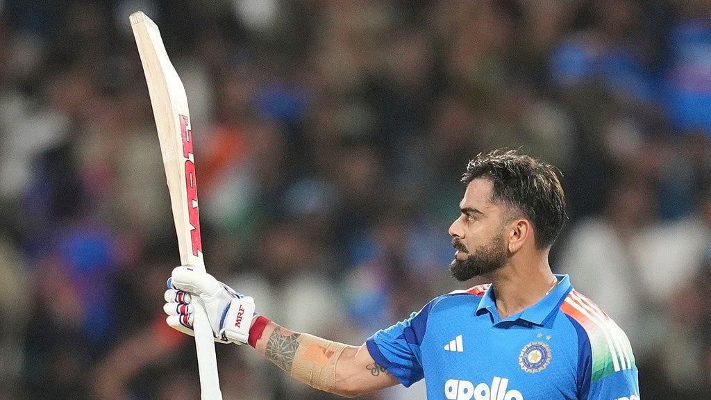 India's Virat Kohli celebrates his century during the first one day international cricket match between India and West Indies in Thiruvananthapuram, India - Rafiq Maqbool/AP Photo