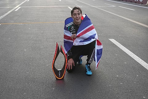 Mercedes driver George Russell of Britain poses with trophy after winning the Azerbaijan F1 Grand Prix auto race, in Baku, Azerbaijan, Saturday, Sept. 26, 2026.
