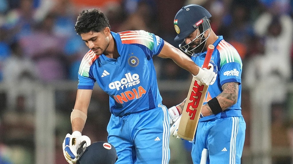 India's captain Shubman Gill, left, celebrates his century during the first one day international cricket match between India and West Indies in Thiruvananthapuram. - Rafiq Maqbool/AP Photo