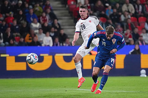 Croatia's Marco Pasalic, right, scores his side's second goal next to Czechia's Jiri Slama during the Nations League soccer match between Czechia and Croatia in Prague.