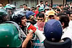 Ujjain Police Begin Crackdown On Social Media Creators After Shahi Masjid Clashes Security personnel interact with people following stone-pelting incidents during protests against the proposed removal of a portion of the 'Shahi Masjid' for road widening, in Ujjain