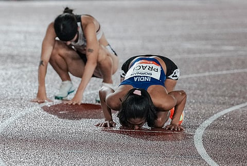 India's Prachi Choudhary, front, celebrates after winning bronze medal in the women's 400m final race during the 20th Asian Games, in Nagoya, Japan, Saturday, Sept. 26, 2026. 