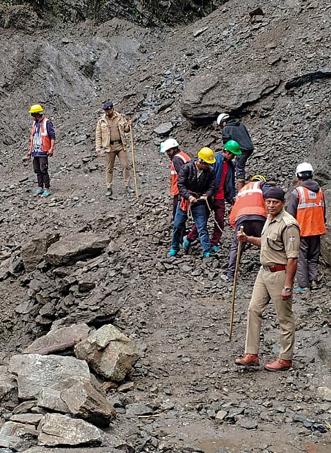 Rescue and disaster management personnel clear debris and boulders to restore the damaged Kedarnath pedestrian trek route following a landslide near the Chirbasa helipad, in Rudraprayag district, Uttarakhand.