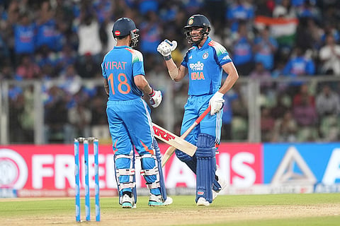 India's Virat Kohli, left, celebrates his fifty runs with captain Shubman Gill during the first one day international cricket match between India and West Indies in Thiruvananthapuram, India.