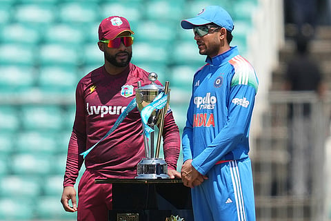 India's captain Shubman Gill, right, and West Indies' captain Shai Hope pose for photograph with trophy during the first one day international cricket match between India and West Indies in Thiruvananthapuram, India.