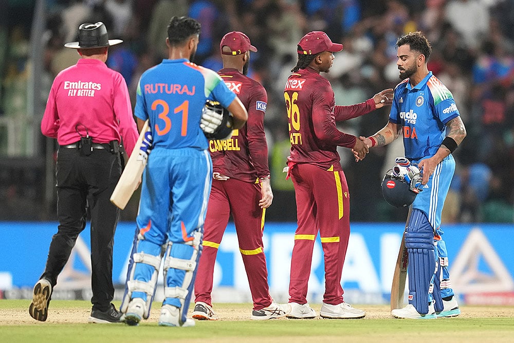 India's Virat Kohli, right, congratulated by West Indies players after India won the first one day international cricket match against West Indies in Thiruvananthapuram, India. - | Photo: AP/Rafiq Maqbool