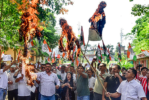 Congress workers burn effigies during a protest against Chief Election Commissioner (CEC) Gyanesh Kumar, in Guwahati, Assam, Monday, Sept. 28, 2026. 