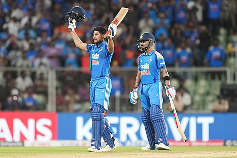 India's captain Shubman Gill, left, celebrates his century as Virat Kohli looks on during the first one day international cricket match between India and West Indies in Thiruvananthapuram, India.