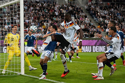 Greece's Manolis Saliakas, left, and Germany's Yann Bisseck fight for the ball during the UEFA Nations League soccer match between Germany and Greece in Augsburg, Germany, Sunday, Sept. 27, 2026.